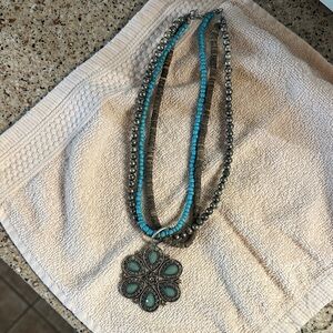 Turquoise colored Beaded Multi-Strand Necklace with Floral Pendant